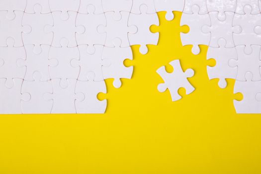White jigsaw puzzle pattern background. jigsaw puzzle