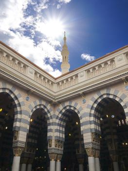 Madinah, Saudi Arabia - July 07, 2020: View of cloudy blue sky at Nabawi Mosque or Prophet Mosque in Madinah, Saudi Arabia. Selective focus