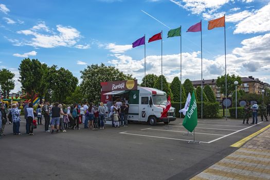 Belarus, Minsk - May 27, 2017: A queue for tasting coffee in a mobile cafeteria