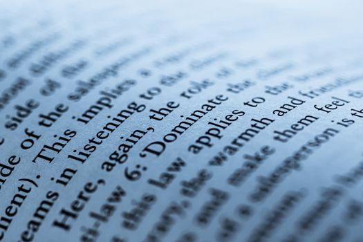 Blue toned macro closeup of an open book, education and studies