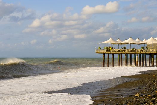 BATUMI, GEORGIA - JULY 09, 2020: Stormy weather, waves and splashes in Batumi, Georgia. Stormy Black sea. Water background.