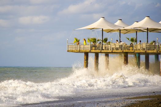 BATUMI, GEORGIA - JULY 09, 2020: Stormy weather, waves and splashes in Batumi, Georgia. Stormy Black sea. Water background.