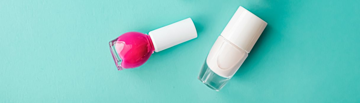 Nail polish bottles on green background, beauty branding