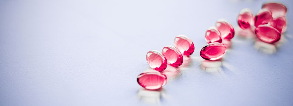 Pharmaceutical, branding and science concept - Red pills for healthy diet nutrition, supplements pill and probiotics capsules, healthcare and medicine as pharmacy and scientific research background