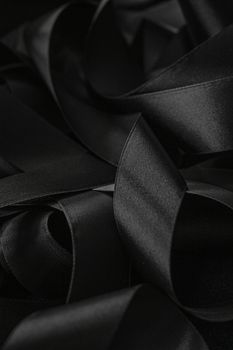 Black silk ribbon as background, abstract and luxury brand designs