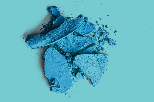 Blue eye shadow powder as makeup palette closeup, crushed cosmetics and beauty textures