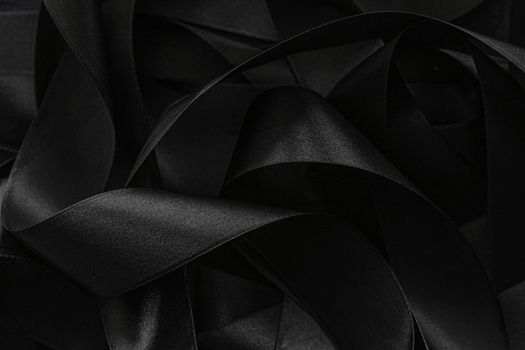 Black silk ribbon as background, abstract and luxury brand designs