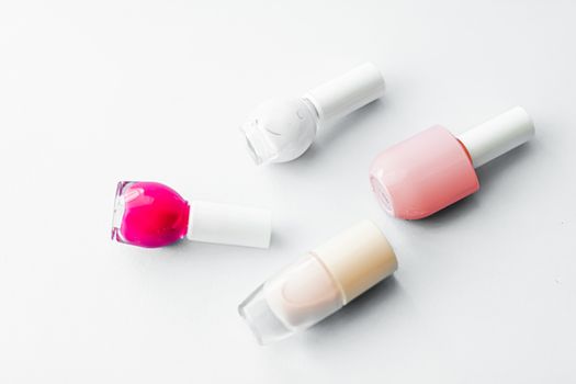 Nail polish bottles on white background, beauty branding