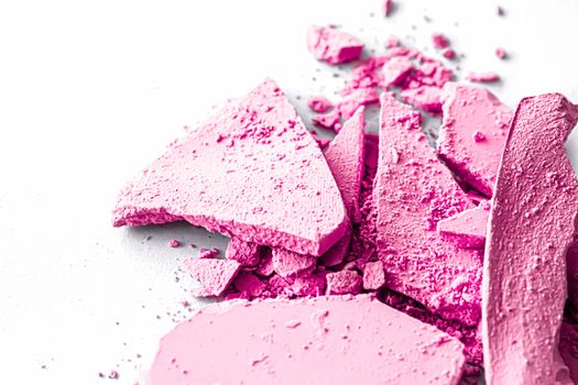 Pink eye shadow powder as makeup palette closeup isolated on white background, crushed cosmetics and beauty textures