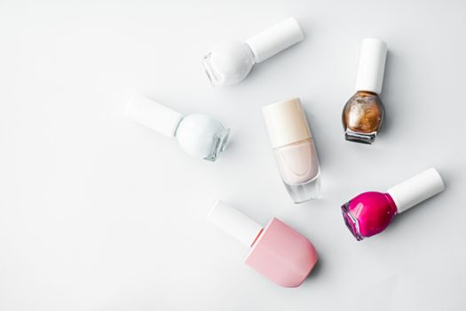 Nail polish bottles on white background, beauty branding