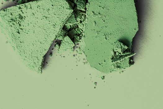 Green eye shadow powder as makeup palette closeup, crushed cosmetics and beauty textures