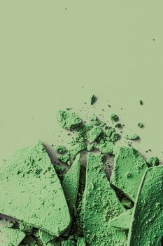 Green eye shadow powder as makeup palette closeup, crushed cosmetics and beauty textures