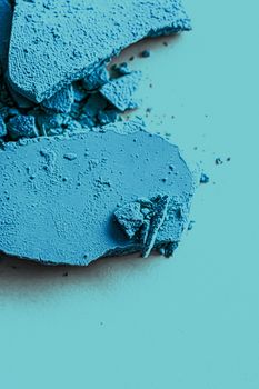 Blue eye shadow powder as makeup palette closeup, crushed cosmetics and beauty textures