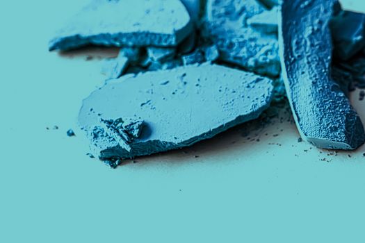 Blue eye shadow powder as makeup palette closeup, crushed cosmetics and beauty textures