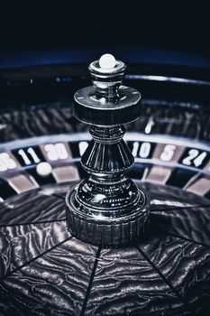 Roulette wheel in casino, gambling ads