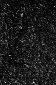 Black stone texture as abstract background, design material and textured surfaces