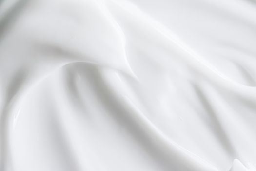 Pure white cream texture as abstract background, food substance or organic cosmetics