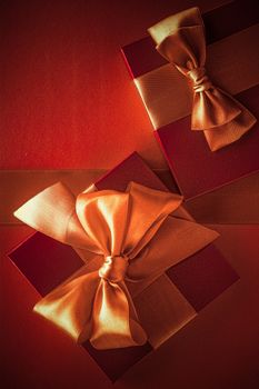 Glamour celebration, wrapped luxe boxes and shopping sale concept - Luxury gifts with golden bow as holiday background, Valentines Day presents surprise