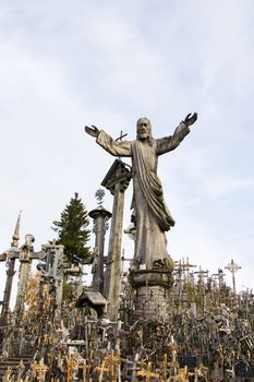 LITHUANIA - OCTOBER 23, 2017: Hill of crosses, large group of crosses on the hill in Lithuania, Famous landmark, must visit place.