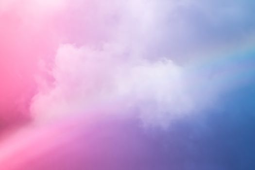 Rainbow in fantasy pink and blue sky, spiritual and nature backgrounds