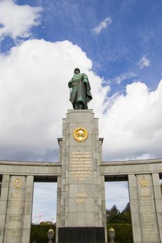 The Soviet War Memorial at Tiergarten in Berlin, Germany. Famous memorial, must visit place. Blue sky background.