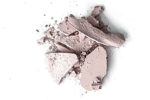 Pale eye shadow powder as makeup palette closeup isolated on white background, crushed cosmetics and beauty textures