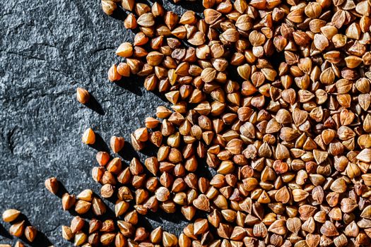 Buckwheat grain closeup, food texture and cook book backgrounds