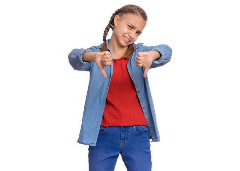 Portrait of teen girl giving thumbs down gesture looking with negative expression and disapproval, isolated on white background