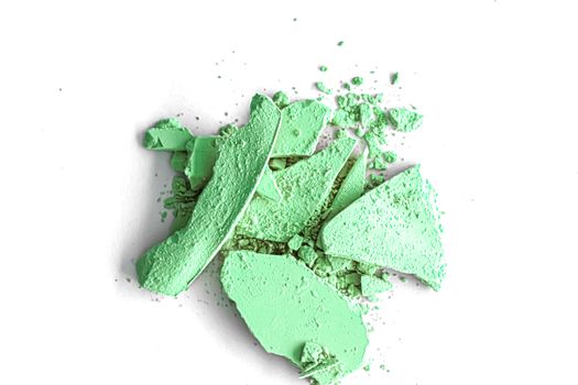 Green eye shadow powder as makeup palette closeup isolated on white background, crushed cosmetics and beauty textures