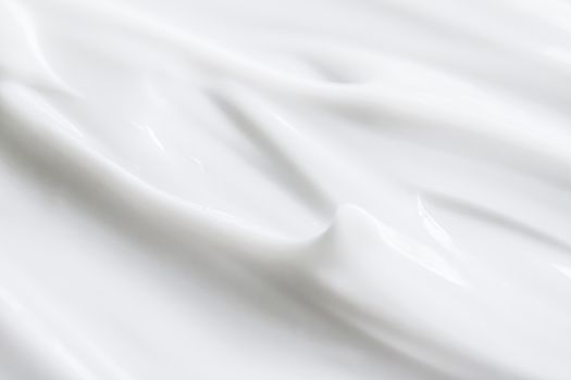 Pure white cream texture as abstract background, food substance or organic cosmetics