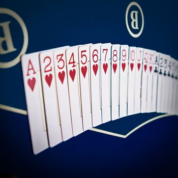 Playing cards game in casino, gambling ads