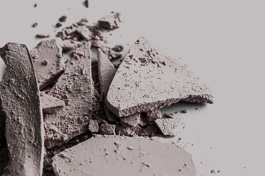 Pale eye shadow powder as makeup palette closeup, crushed cosmetics and beauty textures