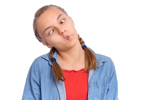 Beautiful crazy teenage girl makes funny face and sticks out tongue, plays fool, being in good mood, isolated on white background