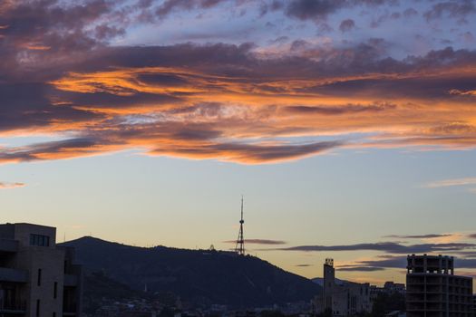 City view and city scape of Tbilisi,Georgia.Building roofs, architecture and history landmarks, must visit place at Sunset time.