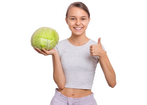 Beautiful young teen girl holding fresh green cabbage, isolated on white background