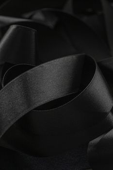 Black silk ribbon as background, abstract and luxury brand designs