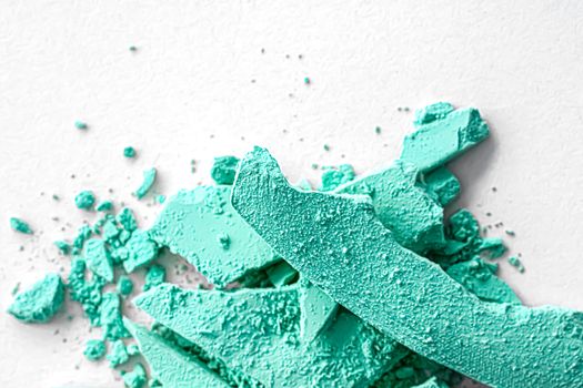 Mint eye shadow powder as makeup palette closeup isolated on white background, crushed cosmetics and beauty textures