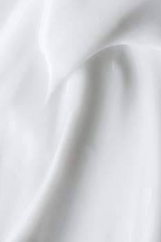 Pure white cream texture as abstract background, food substance or organic cosmetics