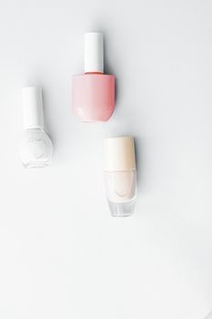 Nail polish bottles on white background, beauty branding