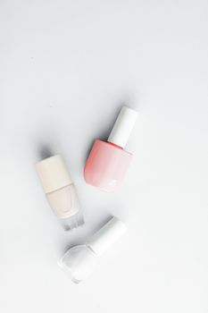 Nail polish bottles on white background, beauty branding