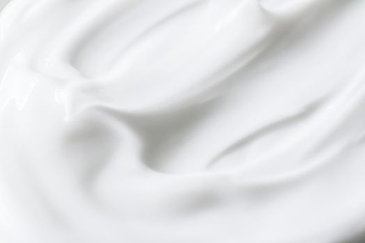 Pure white cream texture as abstract background, food substance or organic cosmetics