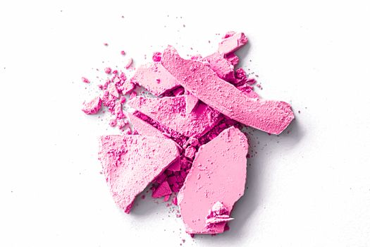 Pink eye shadow powder as makeup palette closeup isolated on white background, crushed cosmetics and beauty textures