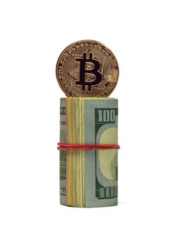 On a white background, a platinum coin Bitcoin stands on a cylinder of dollar bills