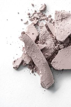 Pale eye shadow powder as makeup palette closeup isolated on white background, crushed cosmetics and beauty textures