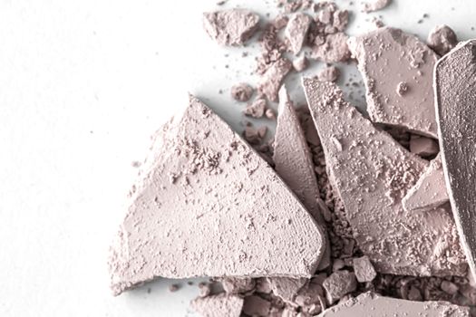 Pale eye shadow powder as makeup palette closeup isolated on white background, crushed cosmetics and beauty textures