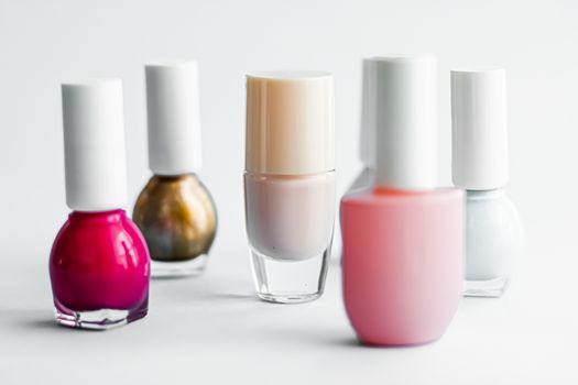 Nail polish bottles on white background, beauty branding