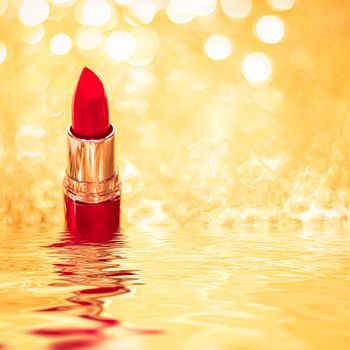 Red lipstick on golden background, make-up and cosmetics product