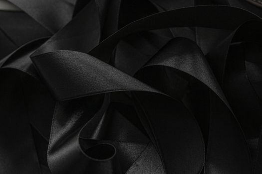 Black silk ribbon as background, abstract and luxury brand designs