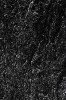 Black stone texture as abstract background, design material and textured surfaces