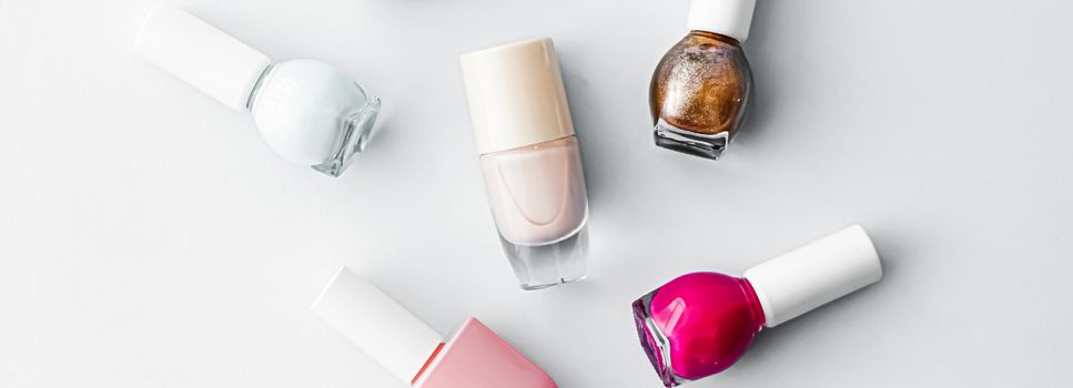 Nail polish bottles on white background, beauty branding